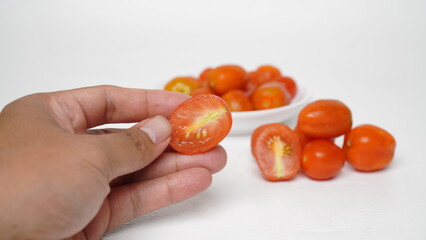 Red cherry tomatoes isolated on white background
