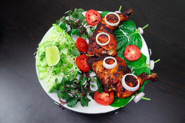 Chicken pieces marinated in curd, spice and herb mixture and oven-fried. Where juicy slow-roasted. So that I get the fragrance of tandoori chicken