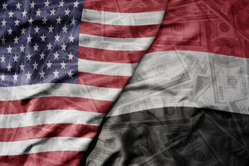 big waving colorful flag of united states of america and national flag of yemen on the dollar money...