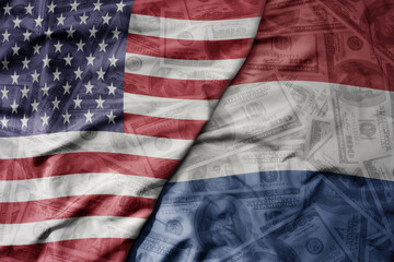 big waving colorful flag of united states of america and national flag of netherlands on the dollar money background. finance concept .