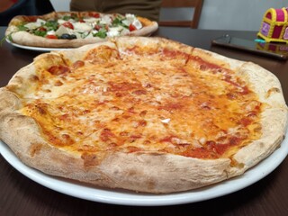 Pizza margarita on a plate, Italian pizza Margarita, 