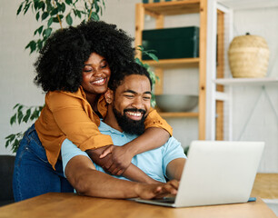 laptop man woman computer technology home couple young together happy happiness smiling togetherness male internet online wife love