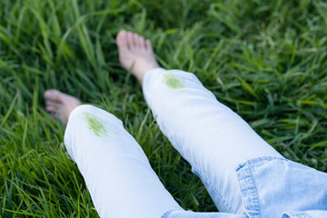 Close up dirty grass stains on white clothes. outdoors. top view. 