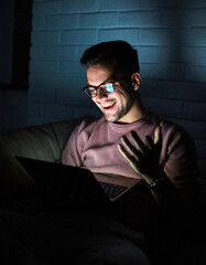 business young man night student laptop computer office guy businessman tv watching television movie startup evening glowing screen social media education