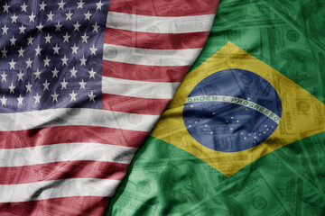 big waving colorful flag of united states of america and national flag of brazil on the dollar money background. finance concept.