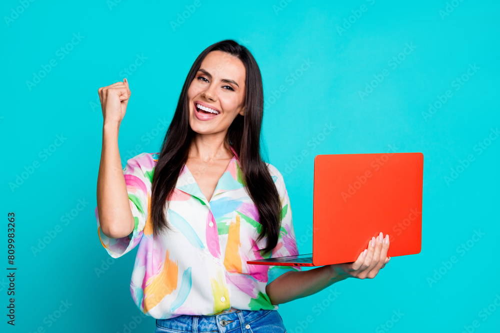 Sticker photo of pretty young woman raise fist use netbook wear shirt isolated on teal color background