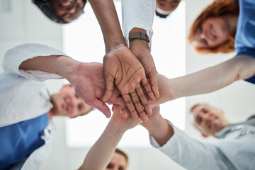 People, hands together and below with medical team for meeting, unity or motivation at hospital....