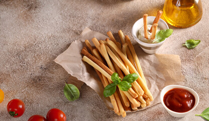 Grissini breadsticks with sauces for appetizers