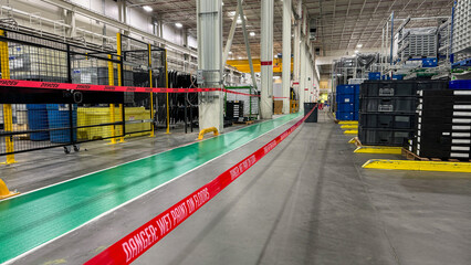 recently coated wet floor safety tape in warehouse