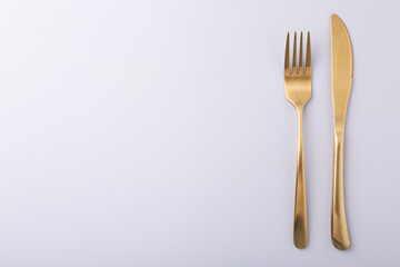 Stylish cutlery on grey table, top view. Space for text