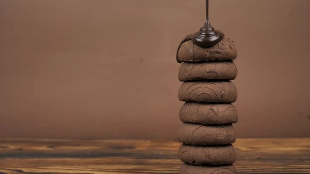 pyramid of chocolate gingerbreads, cookies poured with liquid chocolate. Copy space. place for text.
