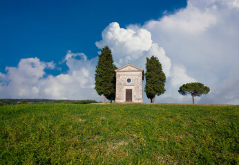 Naklejka premium Chapel of Madonna di Vitaleta in Tuscany, isolated in the countryside of the province of Siena. Framed from a close distance.