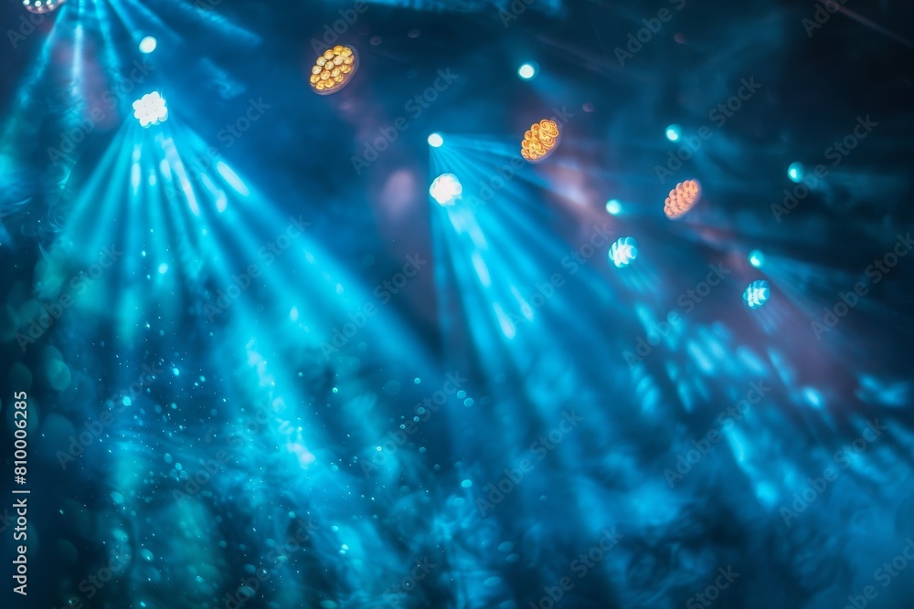 Poster close-up of light beams and floating particles creating a dreamy atmosphere at a concert