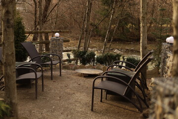 outdoor patio area, fireplace, chairs