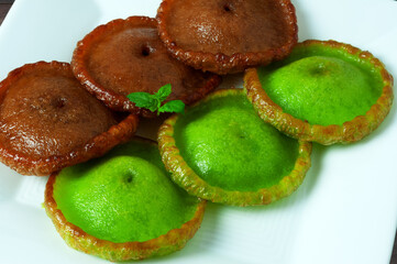 Close up of Mexican Hat dessert, Kuih Pinjaram or penyaram or cucur jawa on a plate