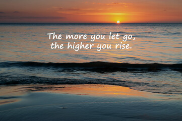 Sunset background with inspirational quotes the more you let go the higher you rise