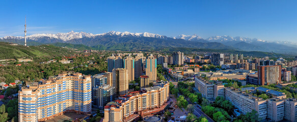 Panoramic view from a quadcopter of the southern part of the largest Kazakh city of Almaty on a...