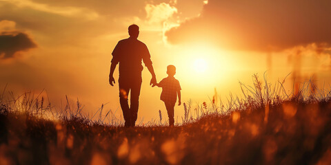A silhouette of a father holding his child's hand walking at sunset, happy fathers day celebration.
