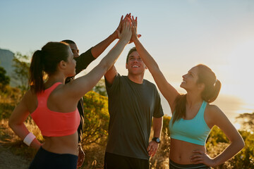 Friends, group and high five for running exercise on mountain for park trail, support or fitness....