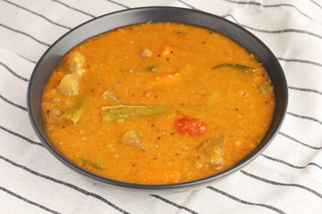Sambar is a lentil-based vegetable stewsoup, cooked with pigeon pea and tamarind broth. It is...