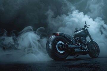 A black motorcycle parked in a foggy area. Suitable for transportation or travel concepts