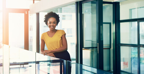 Portrait, smile and business with black woman in modern office, startup and entrepreneur with...
