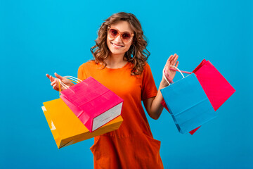 attractive happy smiling stylish woman holding shopping bags