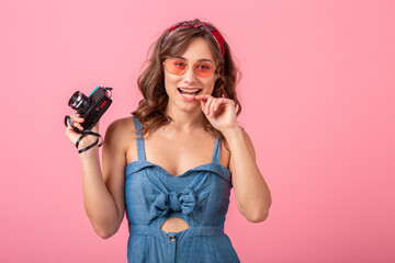 attractive smiling happy woman posing with vintage photo camera