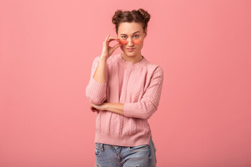 young pretty cute woman in stylish outfit in pink sweater and sunglasses