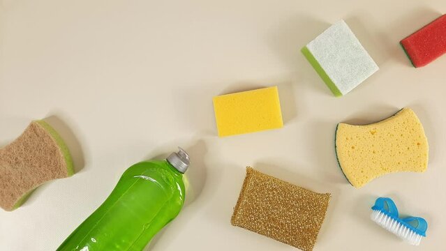 Stop motion with kitchen cleaning items. Various Kitchen thing appear and disappear  on a light background. Fragment for advert Hardware shop. Housecleaning concept looped video