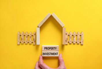 Property investment symbol. Concept words Property investment on beautiful wooden blocks. Wooden...