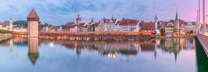 Chapel Bridge, Kapellbrucke over the river Reuss during evening blue hour in Old Town of Lucerne,...