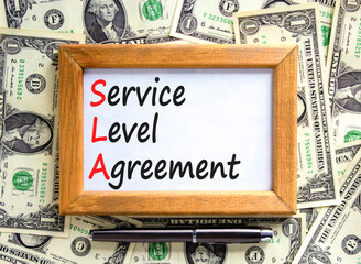SLA service level agreement symbol. Concept words SLA service level agreement on beautiful wooden...