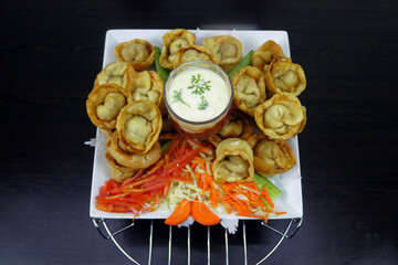 Indulge in the Delicate Delights of Chicken Wontons, Where Savory Fillings Meet Tender Wrappers in a Harmony of Flavor