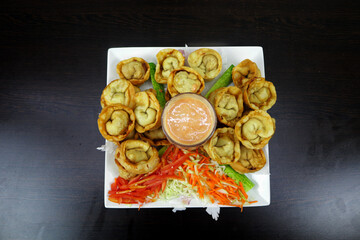 Indulge in the Delicate Delights of Chicken Wontons, Where Savory Fillings Meet Tender Wrappers in a Harmony of Flavor