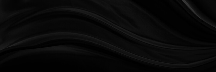 Black gray satin dark fabric texture luxurious shiny that is abstract silk cloth panorama background with patterns soft waves blur beautiful.