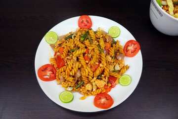 Shahi Chicken Pasta is made with chicken meat, egg, pasta, tomato, carrot, onion, lemon, garlic, green chili, cabbage and other ingredients. It is very tasty to eat and Spicy Flair