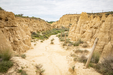 a dirt path across the natural sculptures of Aguarales de Valdemilaz, Valpalmas, comarca of Cinco Villas, province of Zaragoza, Aragon, Spain