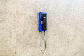 Wall-mounted intercom phone for employee communication