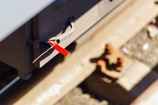 Sealed box with a plastic seal on the lower part of a railcar
