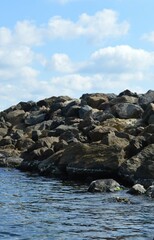 Rocky seashore - summer, blue water