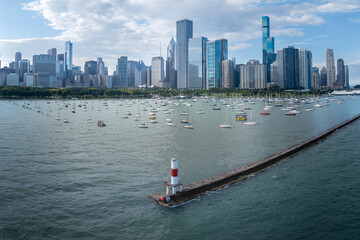 Aerial view of downtown Chicago, Illinois, USA. Over Lake Michigan looking towards small lighthouse and boats.  September 26, 2023. 