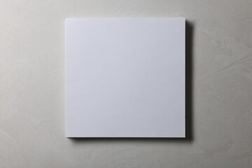 Fototapeta premium Blank paper sheets on grey textured background, top view. Mockup for design