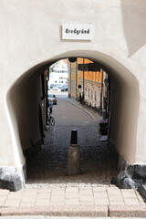 One of many narrow alleys with old houses in the Old Town Stockholm Sweden. Beautiful old city environment. No identifiable people.