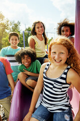 Kids, park and portrait of group in playground to relax with friends in summer on vacation. Happy, holiday and children together for party, games or smile outdoor at middle school recess or break