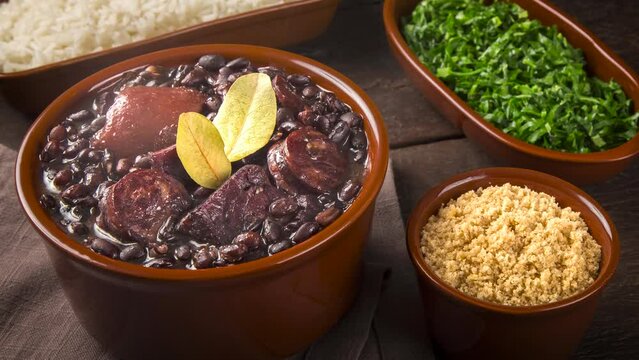 Feijoada with farofa, kale and rice. Feijoada, traditional Brazilian food.