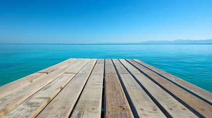 Fototapeta premium A sunny day over a body of water features a wooden dock amidst it, with a boat in the distance