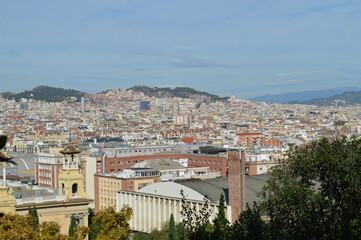 Fototapeta premium Panorma of the city of Barcelona, beautiful historical buildings and urban development - horizon and mountains - view from above, Catalonia, Spain, travel to Europe