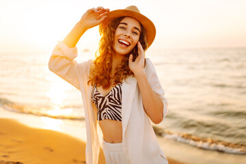 Portrait of the beautiful woman at the summer day relaxing on coast. Travel, weekend, relax and...