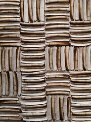 Block motif of elongated shells. A knife handle, also called a razor or an American sword sheath.